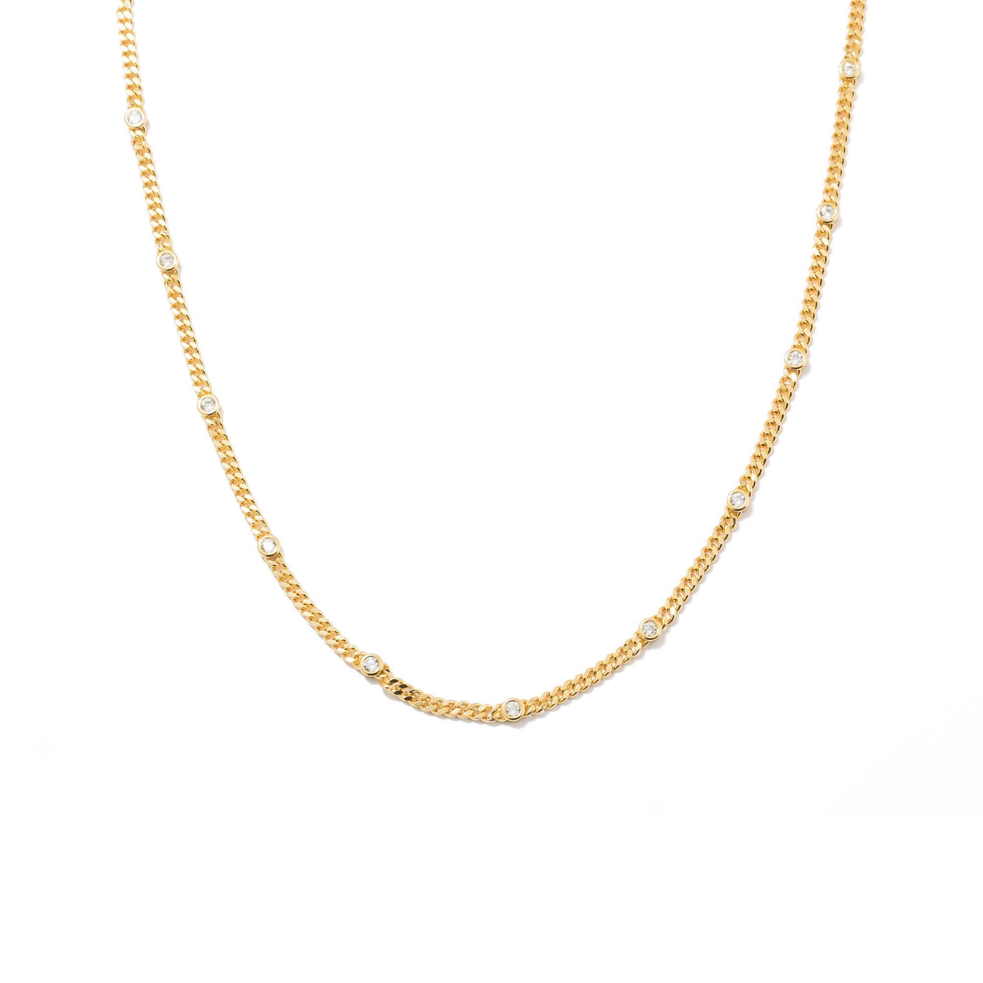 Delicate gold choker with sparkling cubic zirconia accents—elegant, dainty, and perfect for layering or wearing solo.