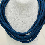 Navy rope necklace with braided texture, slip-on design, and lightweight style.