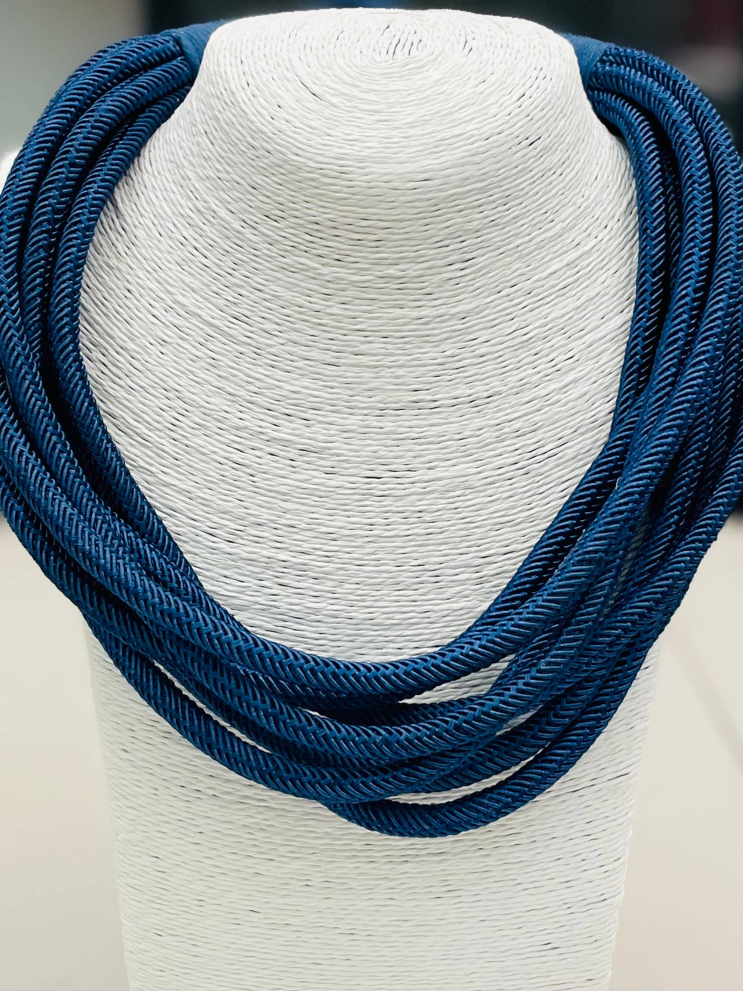 Navy rope necklace with braided texture, slip-on design, and lightweight style.