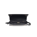 Matte black vegan leather shoulder bag with gold hardware and detachable strap.