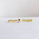 Stretch bracelet with alternating black onyx and pearl beads, accented with a gold-plated detail—chic, bold, and elegant.