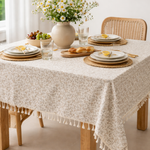 Floral cotton tablecloth with beige and taupe botanical print and ivory tassel fringe