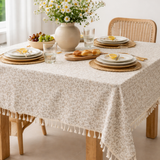 Floral cotton tablecloth with beige and taupe botanical print and ivory tassel fringe