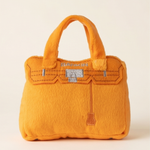 Bright orange plush handbag-shaped dog toy with a built-in squeaker.