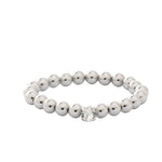 Silver-tone stretch bracelet with repeating metal beads and a single round crystal accent