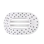 White large flat round hair clip with a black polka dot pattern.