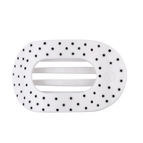 White large flat round hair clip with a black polka dot pattern.