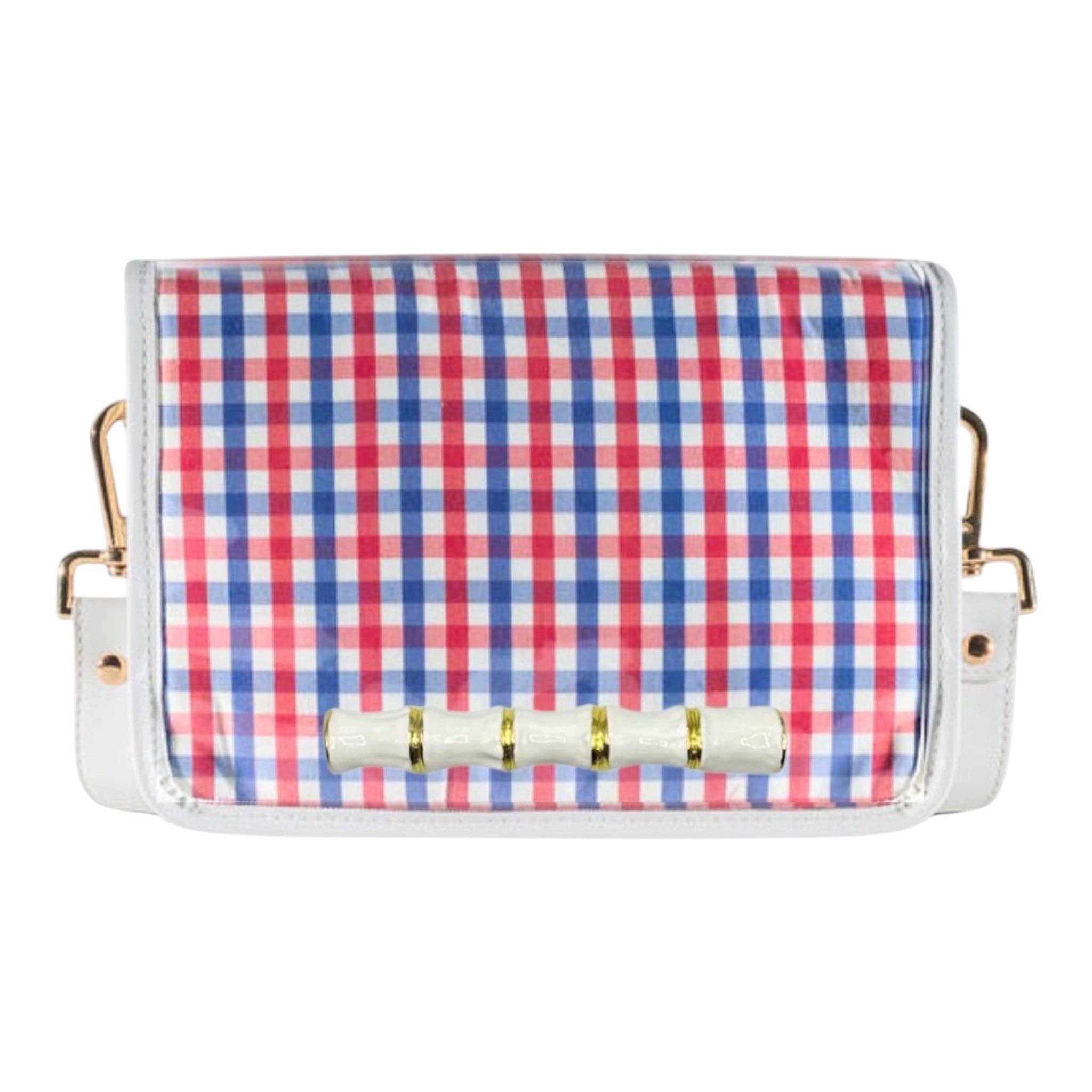 Clear stadium crossbody bag with red and blue gingham flap, white bamboo stick detail, white faux leather trim, and adjustable strap.