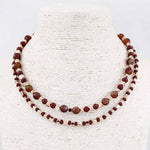 Two-layer beaded necklace with deep maroon, garnet, and cream beads