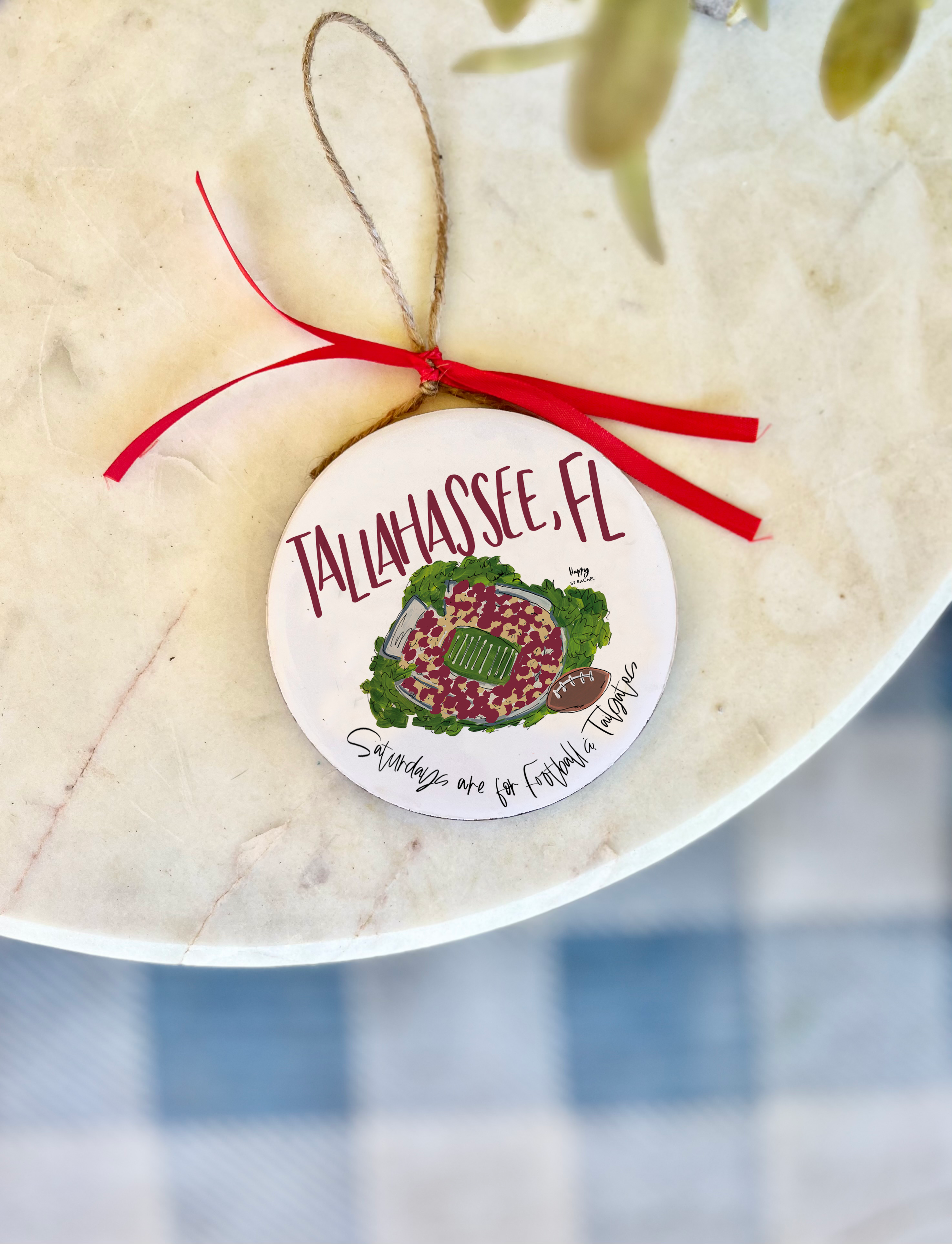 White Tallahassee wood and enamel ornament with hand-painted Doak Campbell Stadium illustration