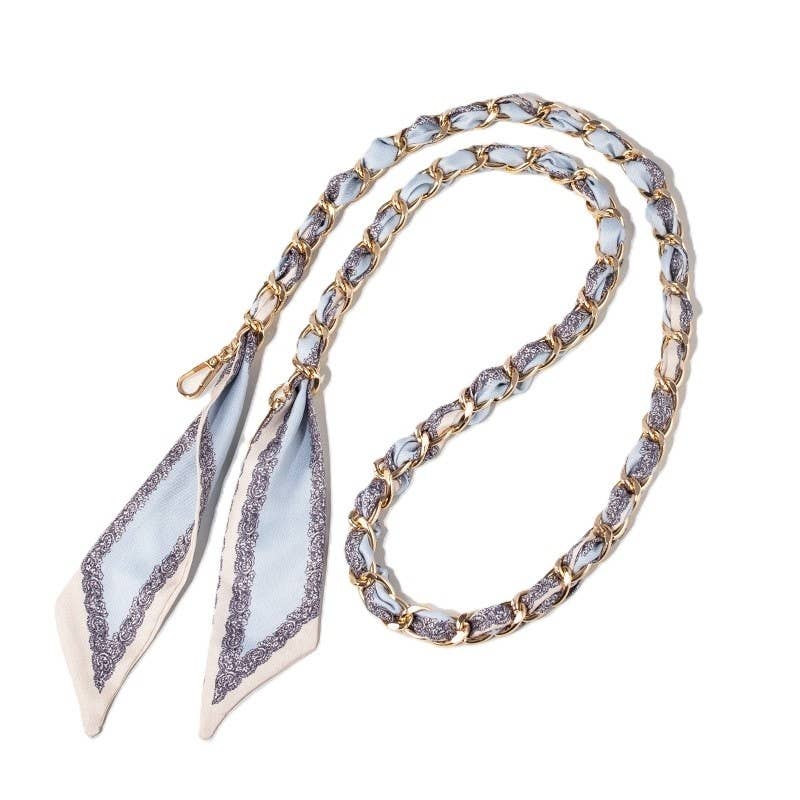 Baby blue and cream scarf woven through gold chain bag strap with clasps.