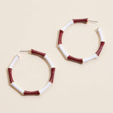 Garnet and white striped enamel hoop earrings with gold trim