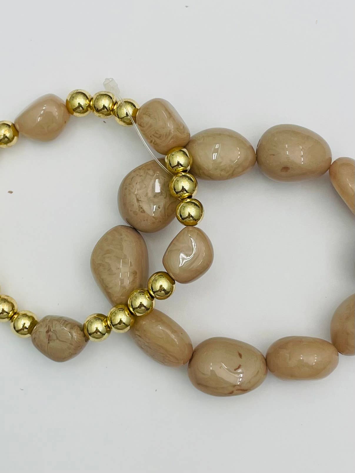 Double Stone Stack bracelet set in beige and gold, stretch design with asymmetrical resin stones and gold beads
