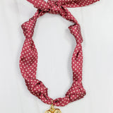 Garnet satin scarf necklace with gold micro-pattern and puff heart charm pendant