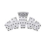 White medium claw clip with a black polka dot pattern.