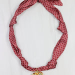 Garnet scarf necklace with white geometric pattern and puff heart charm pendant