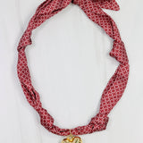 Garnet scarf necklace with white geometric pattern and puff heart charm pendant
