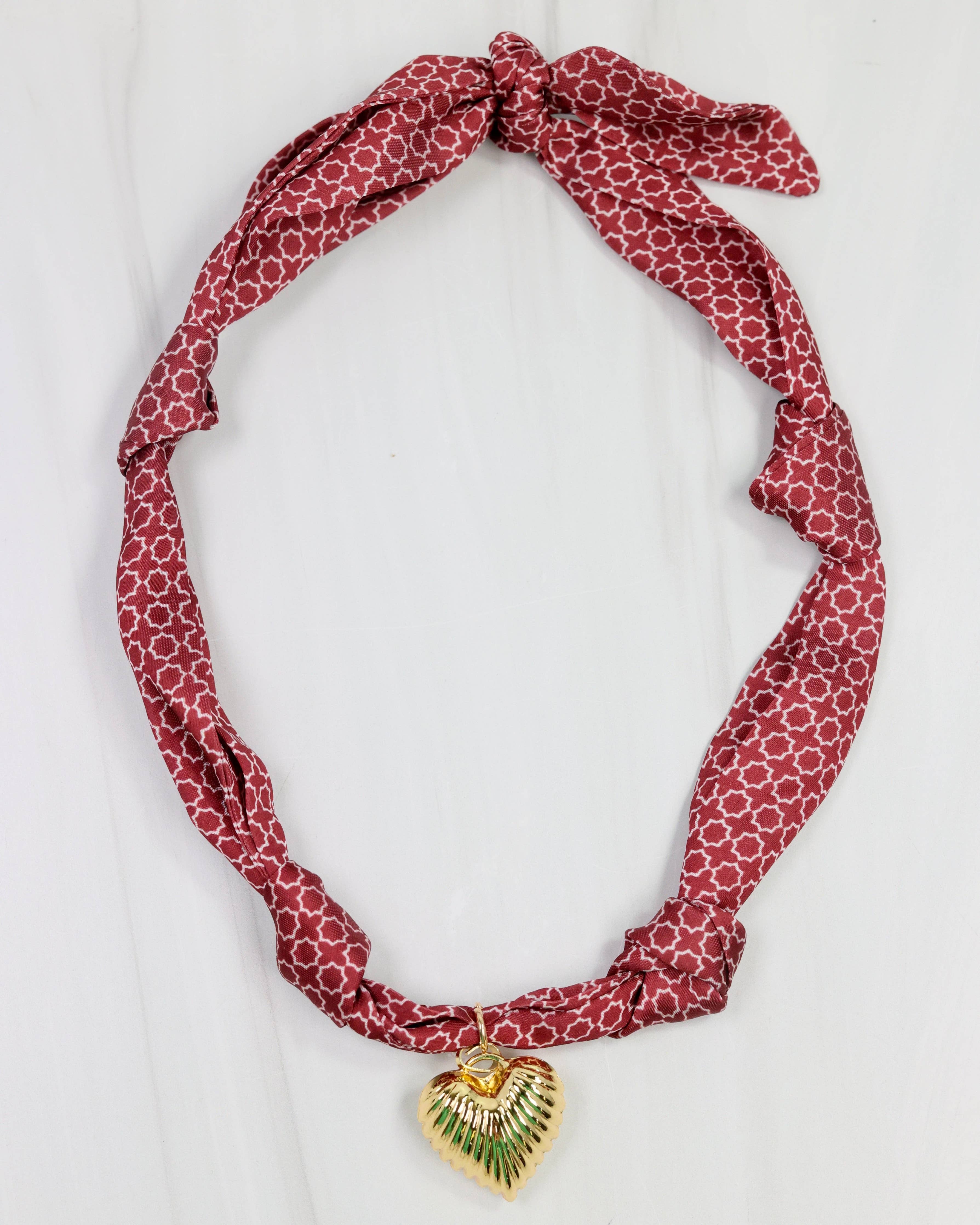 Garnet scarf necklace with white geometric pattern and puff heart charm pendant