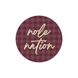 Garnet gingham round button featuring “Nole Nation” in gold cursive lettering.