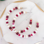 Hoop earrings with garnet and white rubber discs and glass beads