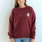 Garnet lantern sleeve crewneck sweatshirt with Seminole head on chest and “Seminoles” lettering on arms and back.