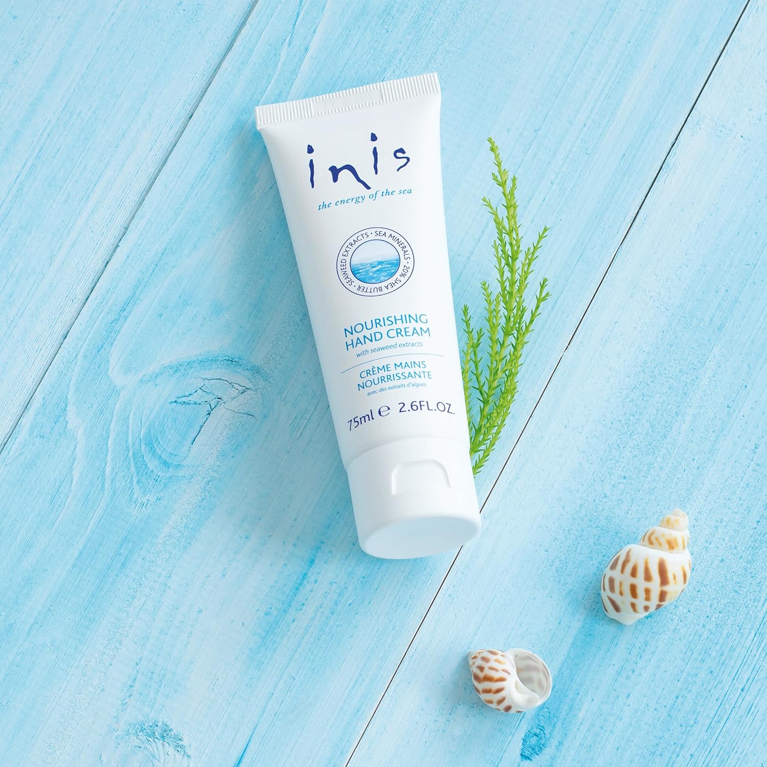 Light blue tube of hand cream with oceanic branding—hydrating, refreshing, and ideal for softening dry hands.
