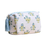 White quilted floral cosmetic pouch with blue and green pattern and tassel zipper
