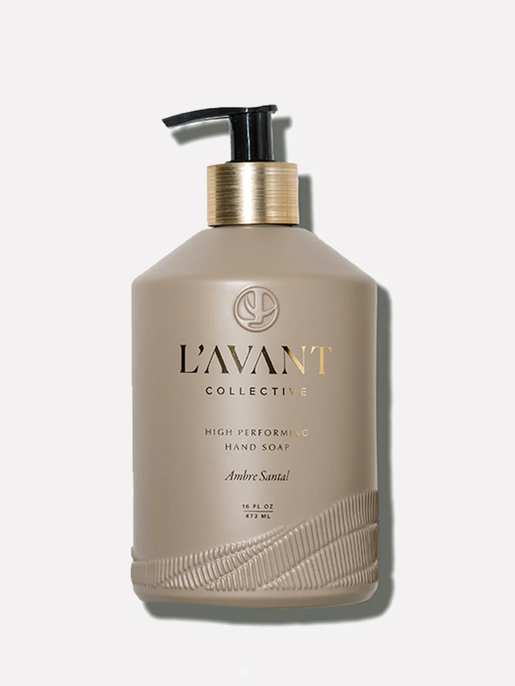 L'AVANT Ambre Santal Hand Soap in glass bottle with brushed gold pump and plant-based cleansing formula.