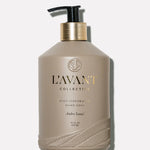 L'AVANT Ambre Santal Hand Soap in glass bottle with brushed gold pump and plant-based cleansing formula.