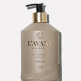 L'AVANT Ambre Santal Hand Soap in glass bottle with brushed gold pump and plant-based cleansing formula.