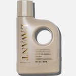L'AVANT Ambre Santal Laundry Detergent in a recycled plastic bottle featuring a concentrated plant-based formula for laundry care.