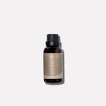 L'AVANT Ambre Santal Laundry Oil in a 1 oz bottle designed for use with wool dryer balls to fragrance laundry
