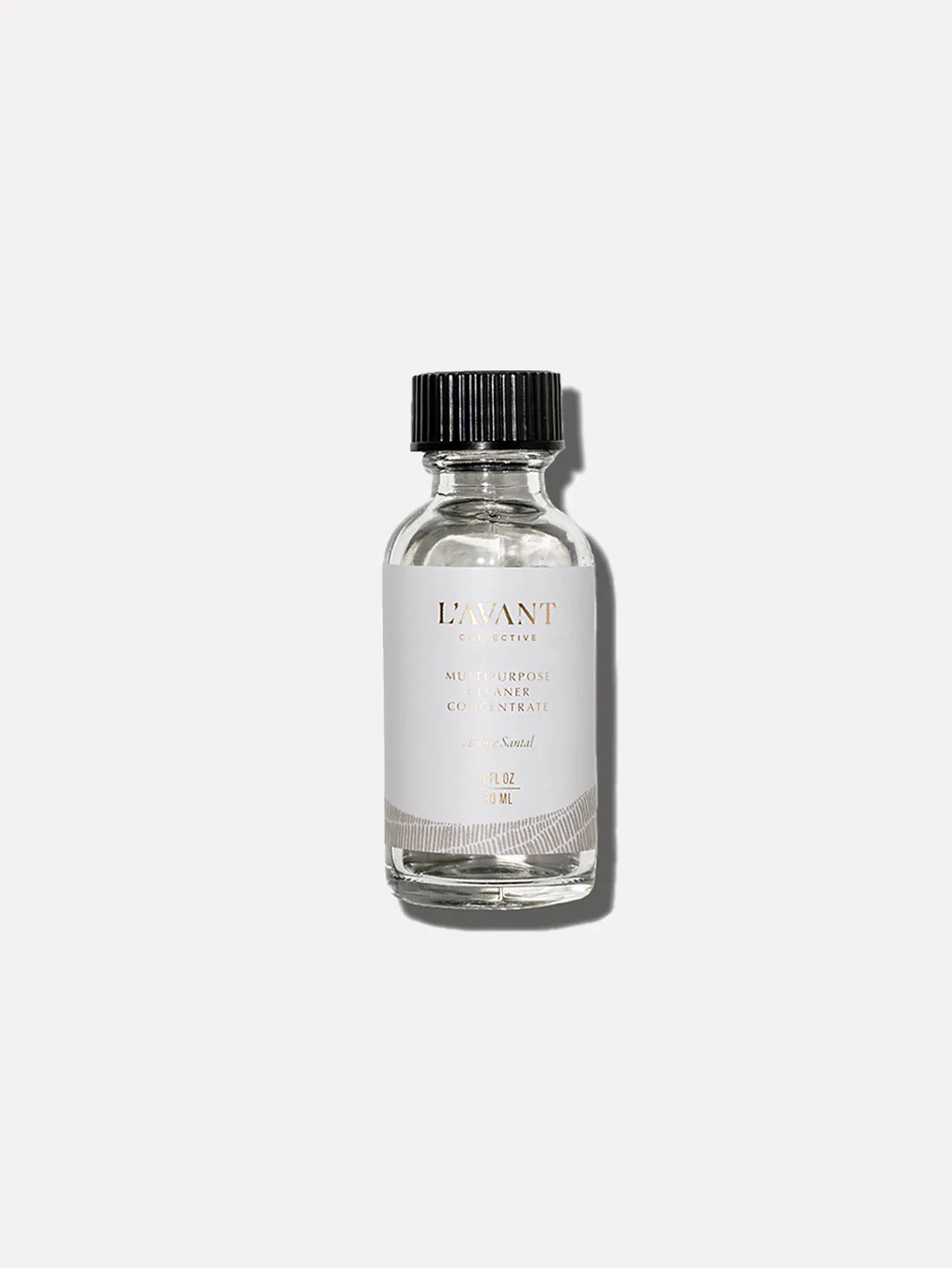 L'AVANT Ambre Santal Multipurpose Surface Cleaner Refill concentrate in a glass bottle for creating reusable cleaning spray.