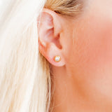  Addison Clear Stone Stud Earrings featuring 8mm gold hexagon studs with a clear CZ stone center