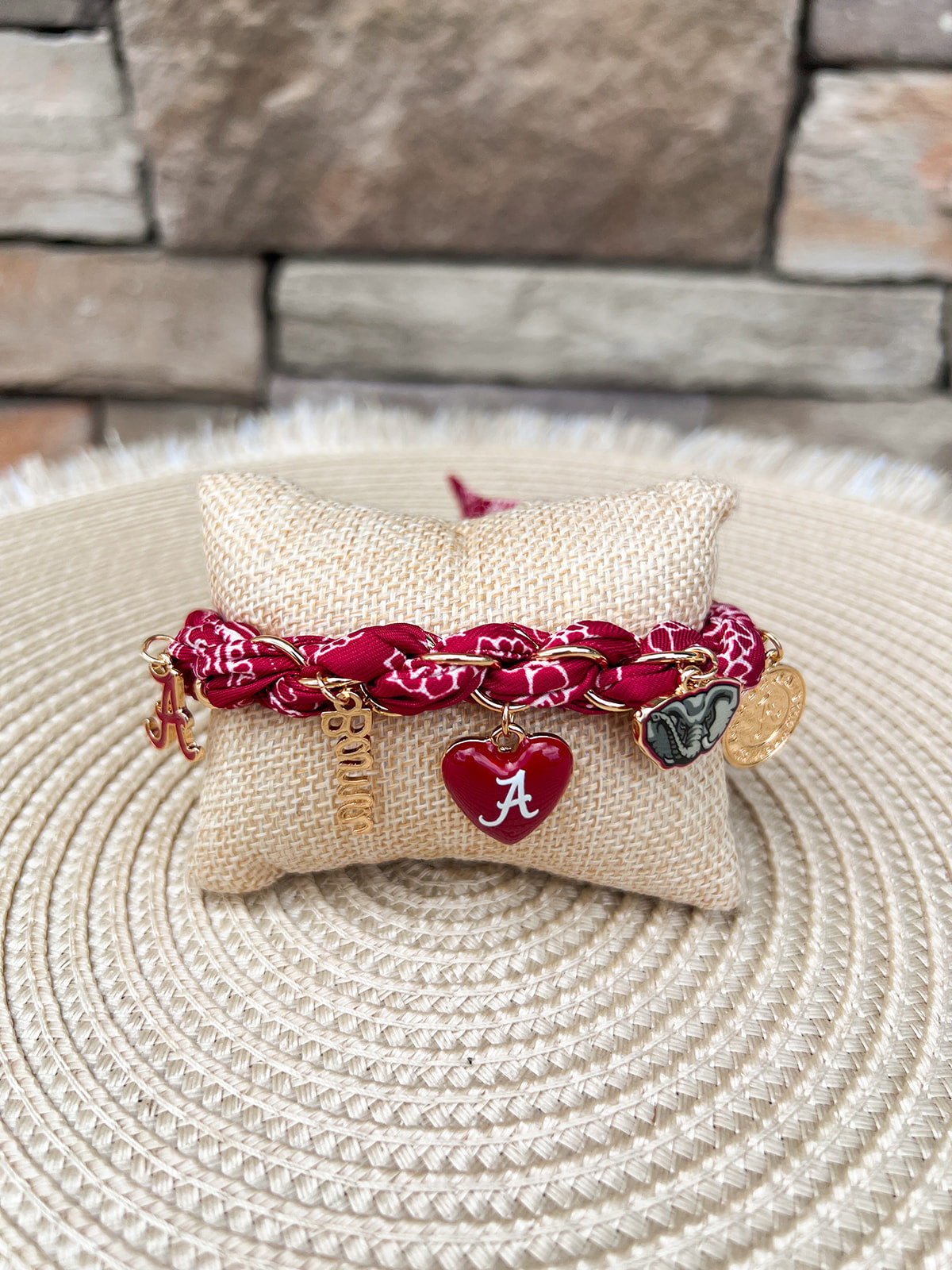 Alabama Crimson Tide adjustable bandana charm bracelet featuring a bandana-style fabric band with gold Alabama-themed charms including the Alabama A, elephant, heart, script, and coin charms.