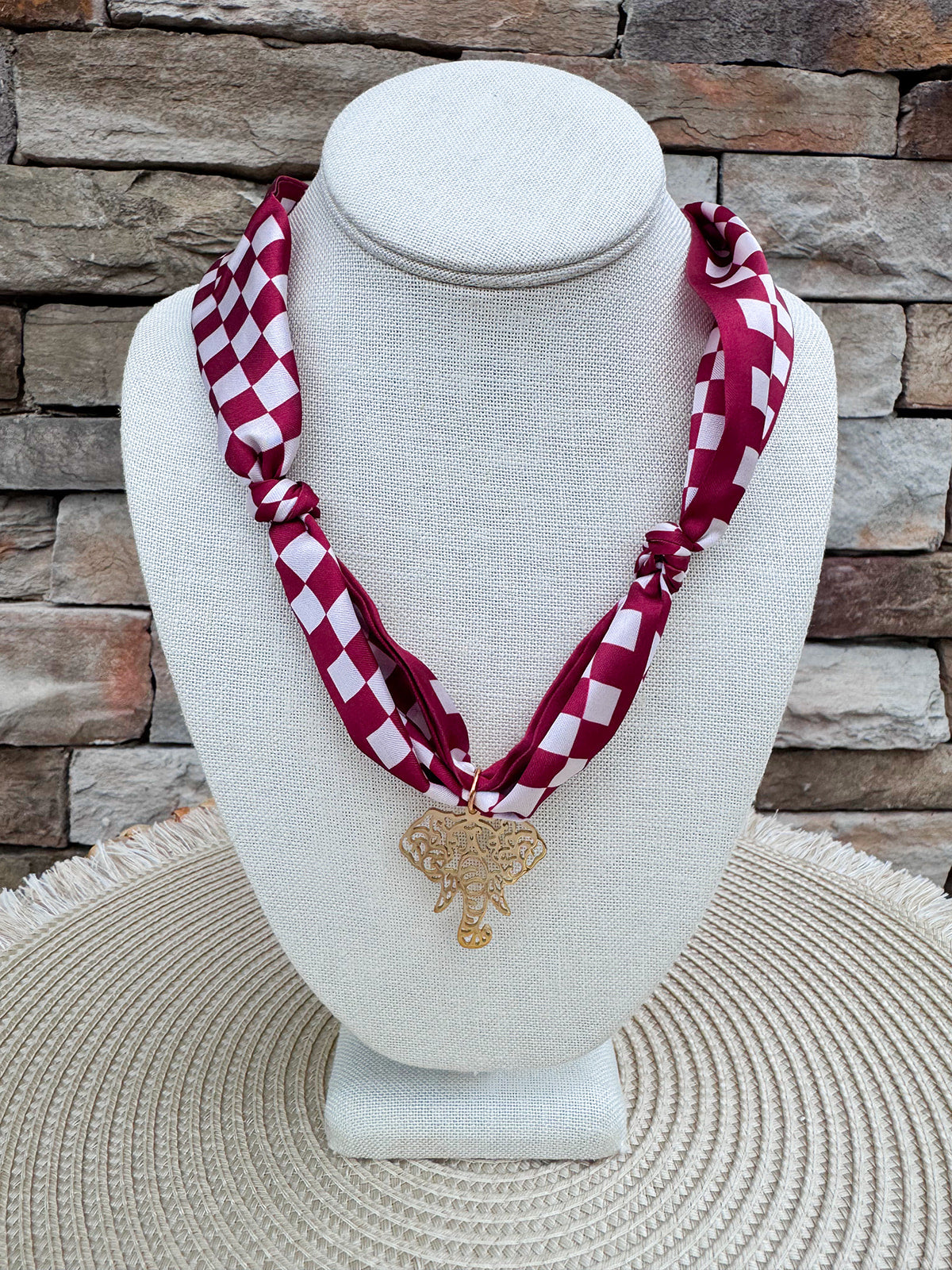Alabama Crimson Tide scarf necklace featuring a silky white and crimson checkerboard scarf with a polished gold elephant charm.