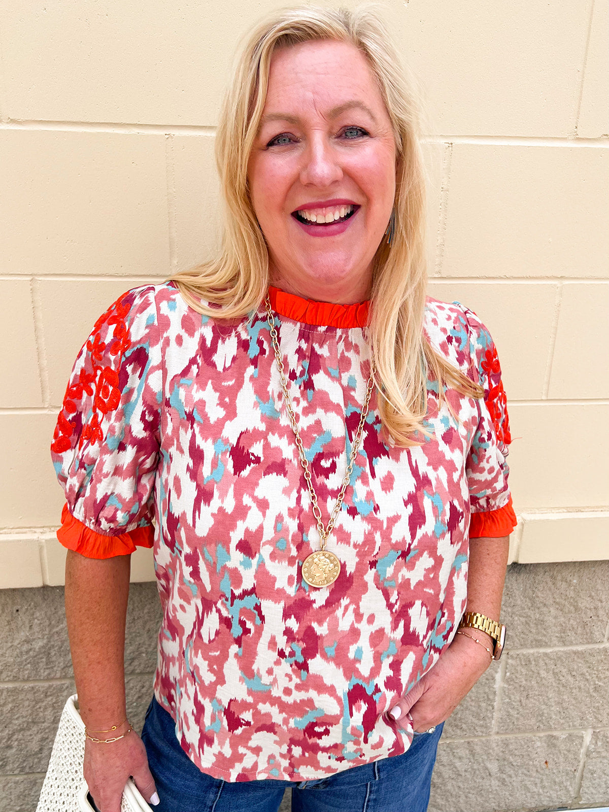 Abstract printed short sleeve blouse with embroidered sleeves and contrast trim