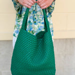 Emerald green woven vegan leather handbag with magnetic closure, interior pouch, and removable solid bottom—chic and functional tote