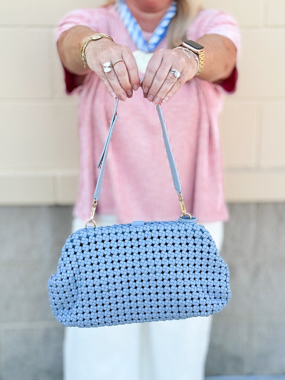 Light blue braided weave clutch handbag with removable strap and spacious interior