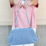 Light blue braided weave clutch handbag with removable strap and spacious interior