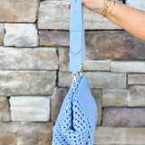 Light blue braided weave clutch handbag with removable strap and spacious interior