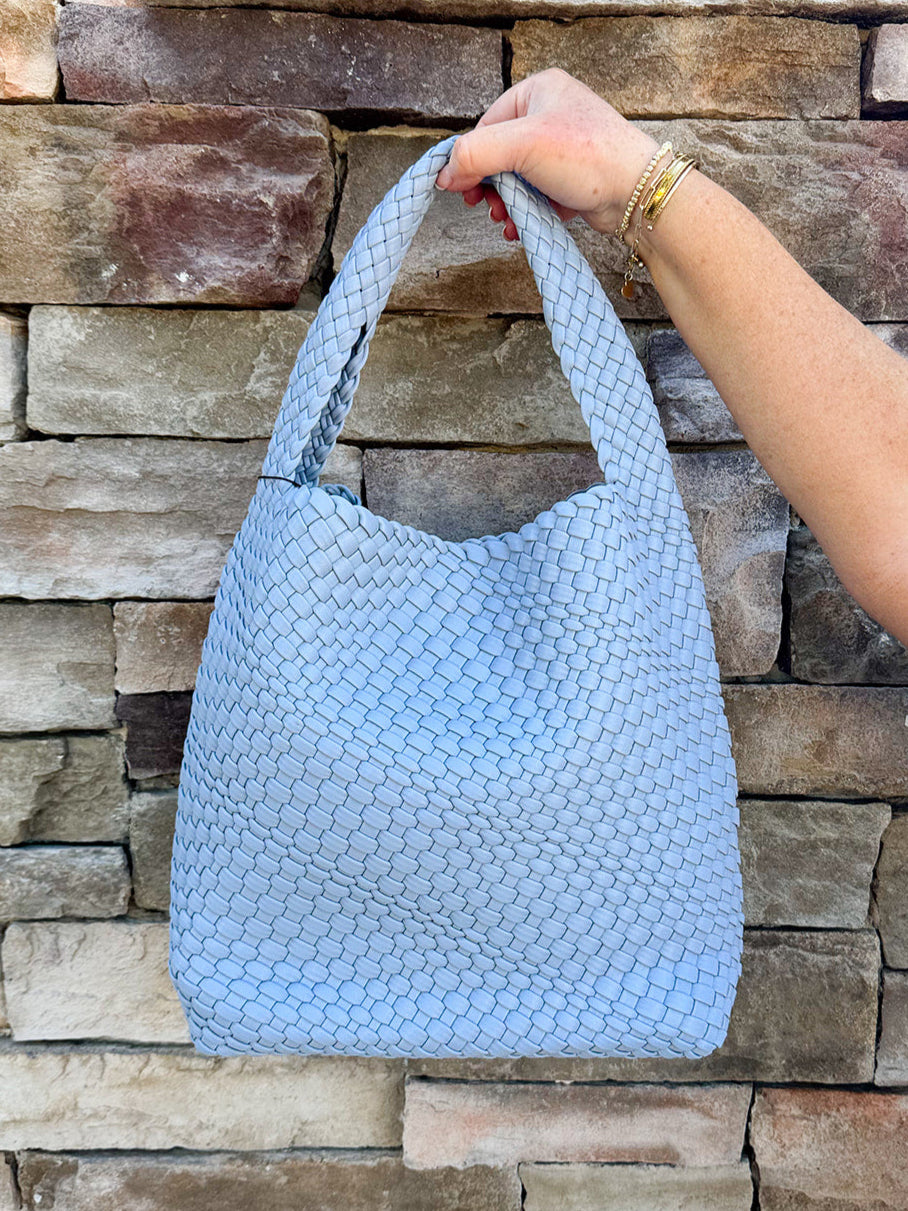 Sky blue woven vegan leather handbag with magnetic closure and spacious design
