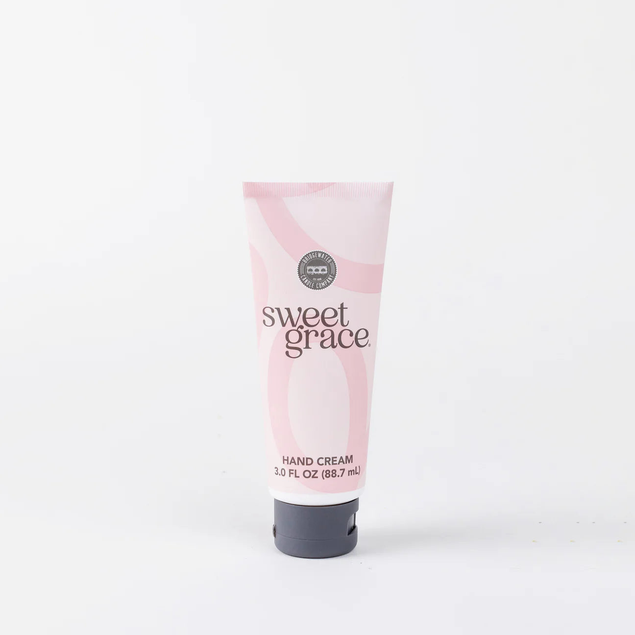 Soft pink hand cream tube styled 