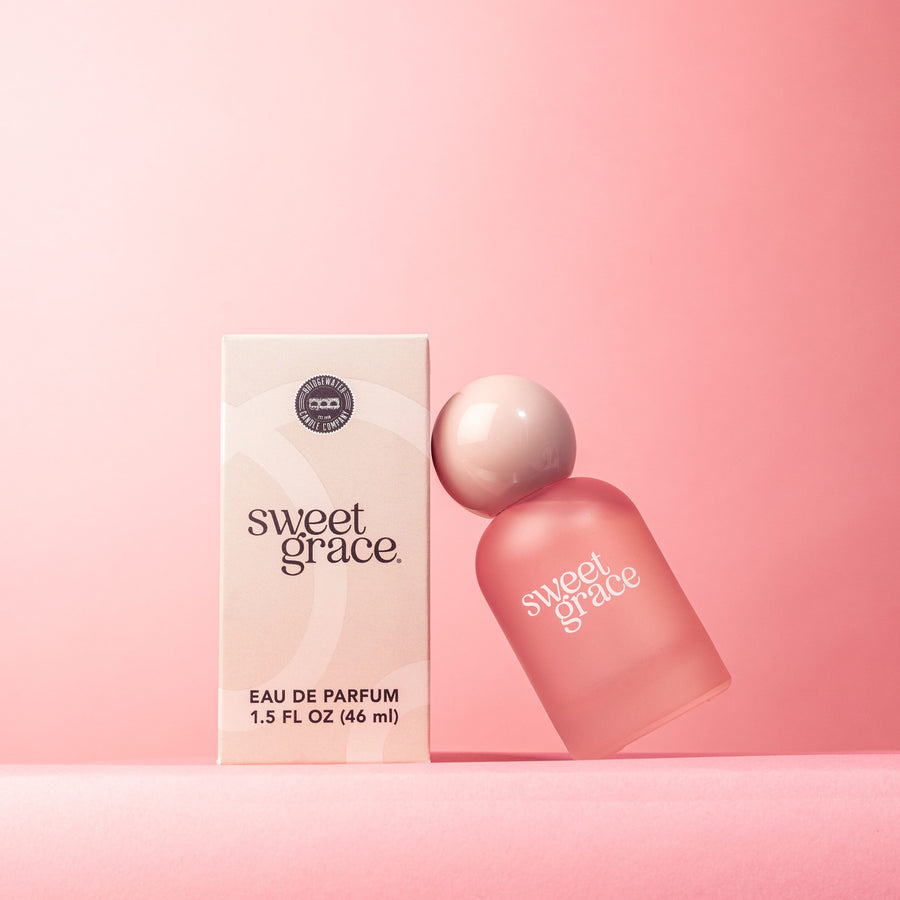 Soft pink perfume bottle styled