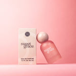 Soft pink perfume bottle styled