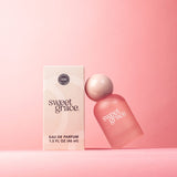 Soft pink perfume bottle styled