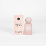 Soft pink perfume bottle styled