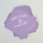 Purple hostess napkins with white text