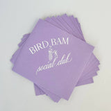 Purple hostess napkins with white text
