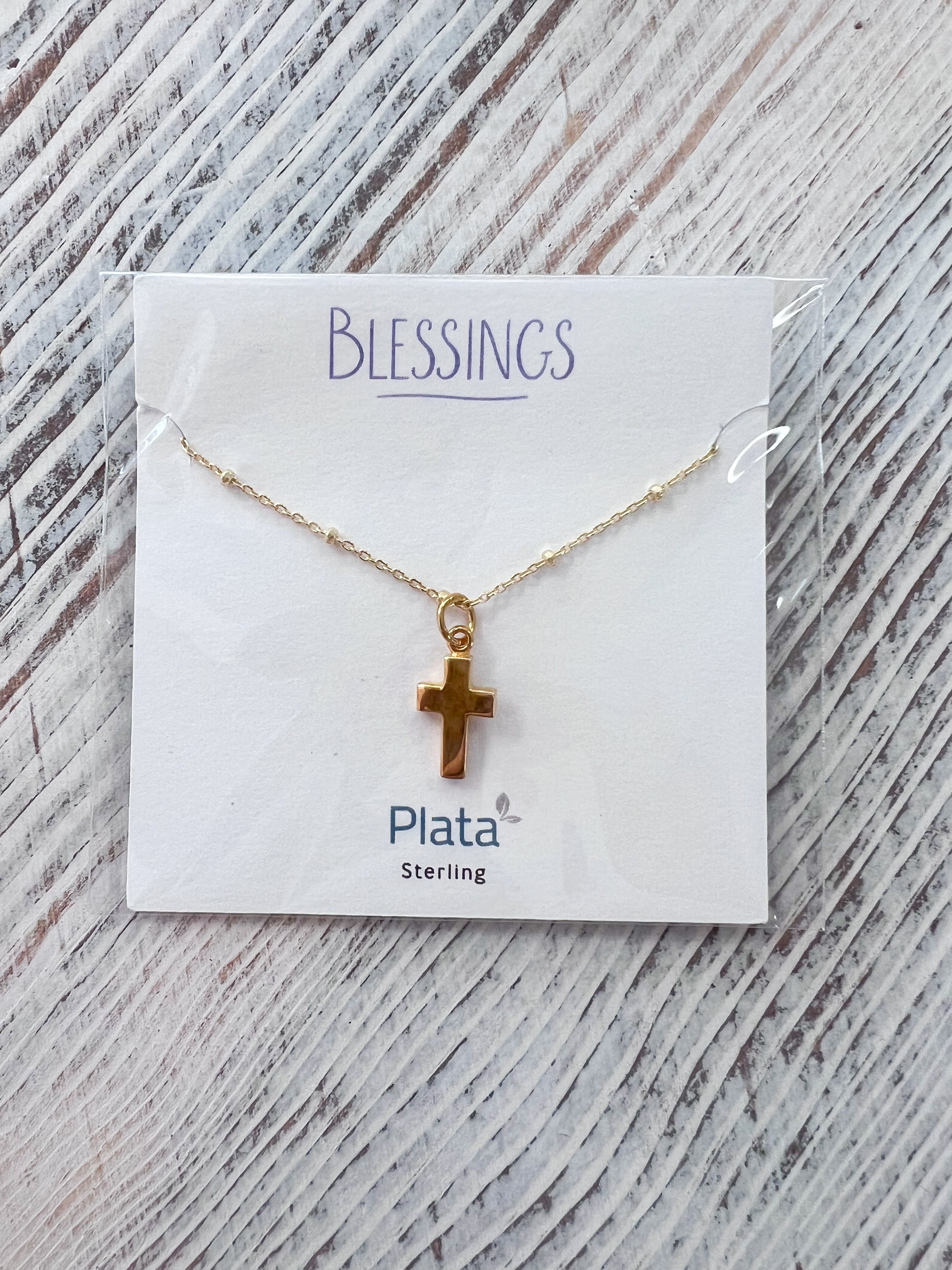 Close-up of Blessings Thick Cross Necklace with textured gold beaded chain and thick cross pendant on white background.